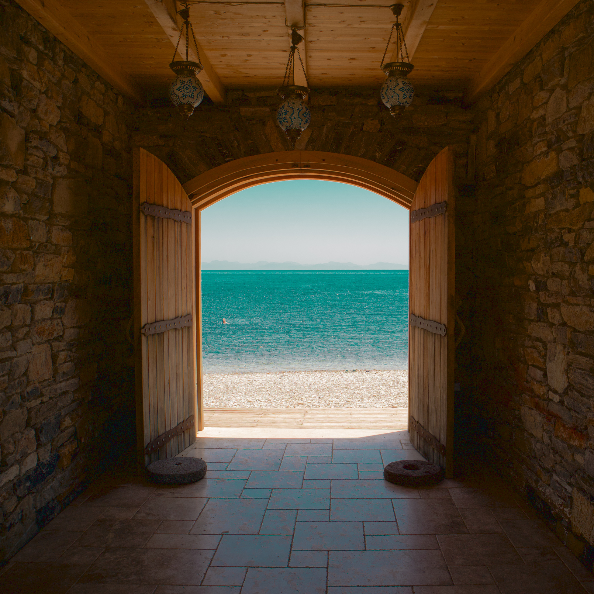 Photograph of Wooden Doors Near a Beach